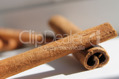 cinnamon sticks lie one to another, daylight