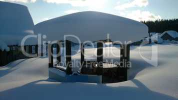 summer kitchen under snowdrift in the sun