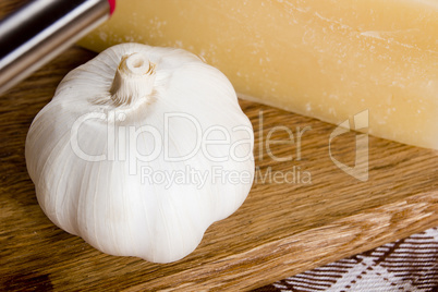 Garlic and cheese on a cutting board
