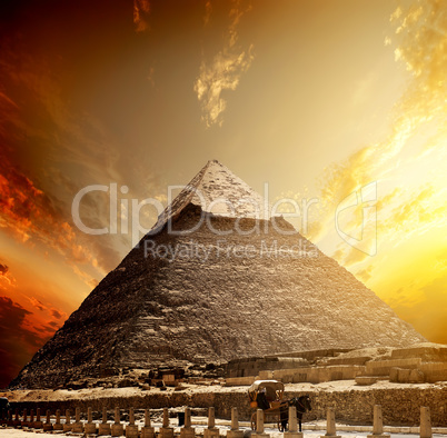 Fiery sunset and pyramid