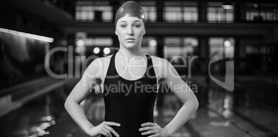 Fit woman in swimsuit with hands on hips