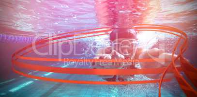 Composite image of athletic swimmer training on her own