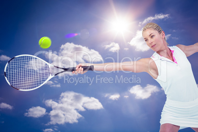 Composite image of athlete playing tennis with a racket