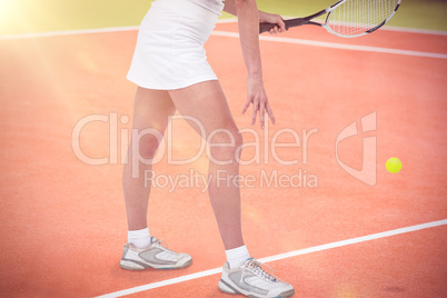 Composite image of athlete playing tennis with a racket