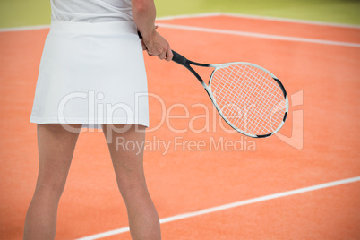 Composite image of athlete playing tennis with a racket