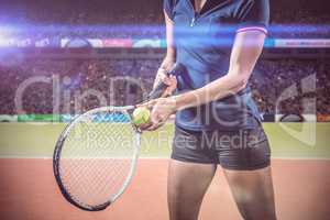Composite image of tennis player holding a racquet ready to serve