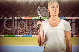 Composite image of female tennis player posing with racket