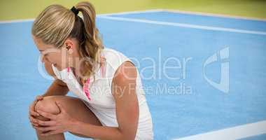 Composite image of injured athlete with tennis racket and tennis
