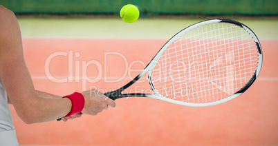 Composite image of athlete playing tennis with a racket