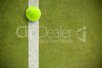 Composite image of tennis ball with a syringe