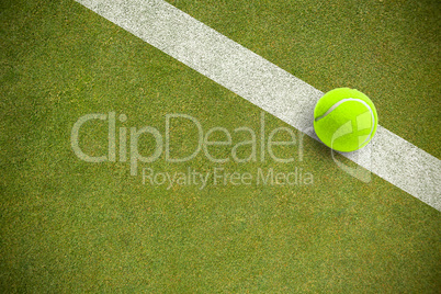 Composite image of tennis ball with a syringe