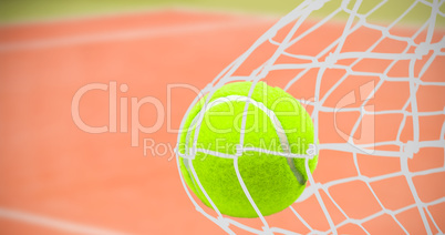 Composite image of tennis ball with a syringe