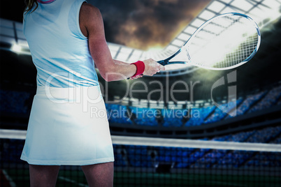 Composite image of athlete playing tennis with a racket