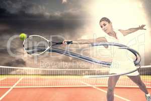 Composite image of athlete playing tennis with a racket