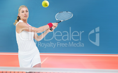 Composite image of athlete playing tennis with a racket