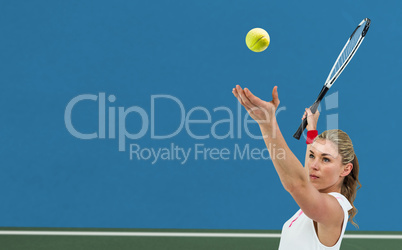 Composite image of athlete holding a tennis racquet ready to ser