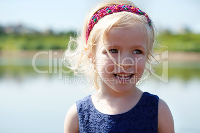 Portrait of funny blonde girl with hair band