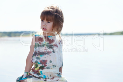 Image of pretty little model posing at lake