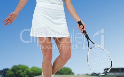 Composite image of athlete playing tennis with a racket