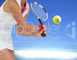 Composite image of athlete playing tennis with a racket