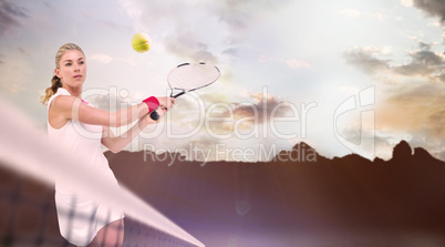 Composite image of athlete playing tennis with a racket