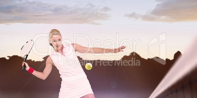 Composite image of athlete playing tennis with a racket