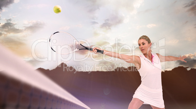 Composite image of athlete playing tennis with a racket