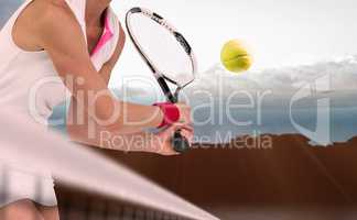 Composite image of athlete playing tennis with a racket