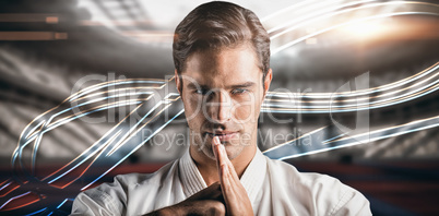 Composite image of portrait of fighter performing hand salute