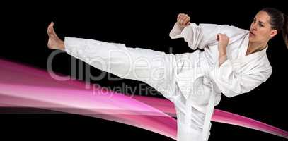 Composite image of fighter performing karate stance