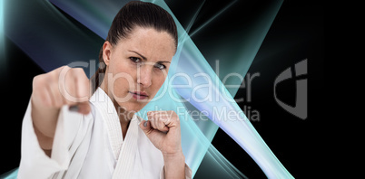 Composite image of fighter performing karate stance