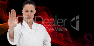 Composite image of female fighter performing karate stance