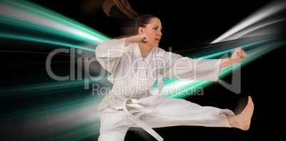 Composite image of fighter performing karate stance