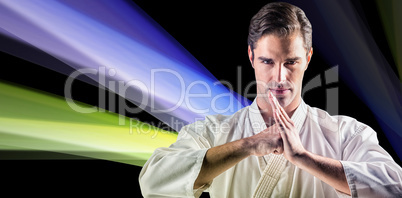 Composite image of portrait of fighter performing hand salute