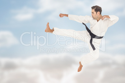 Composite image of fighter performing karate stance