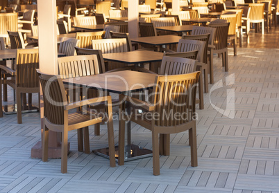 Wooden tables in a outdoor restaurant photo
