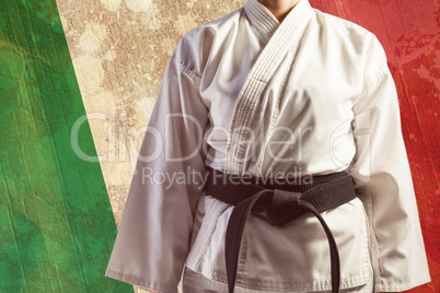 Composite image of mid section of karate player