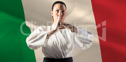 Composite image of female fighter performing hand salute