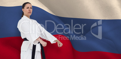 Composite image of female fighter performing karate stance