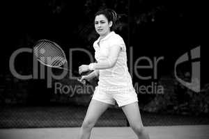 Pretty tennis player playing on court