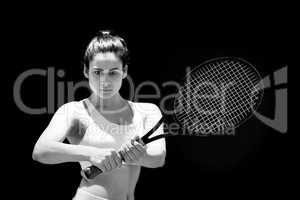 Portrait of confident female tennis player with racquet
