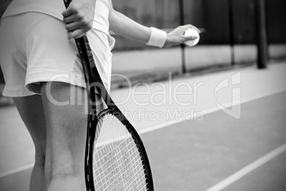 Tennis player getting ready to serve