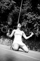 Pretty tennis player celebrating a win
