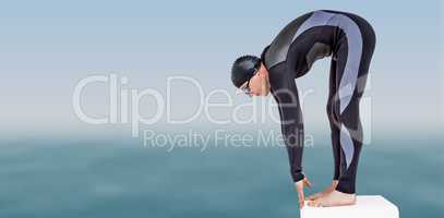 Composite image of swimmer in wetsuit preparing to dive