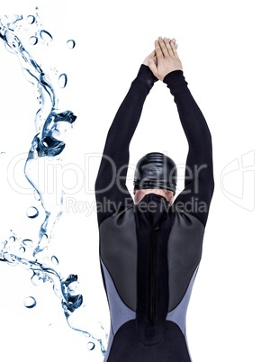 Composite image of rear view of swimmer in wetsuit while diving