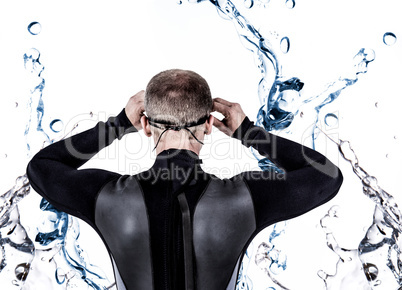 Composite image of rear view of swimmer in wetsuit wearing swimm