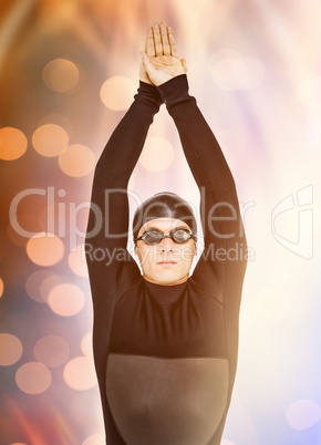 Composite image of swimmer in wetsuit while diving