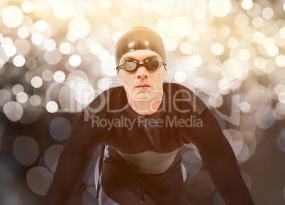 Composite image of confident swimmer in wetsuit