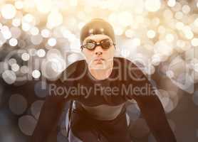 Composite image of confident swimmer in wetsuit