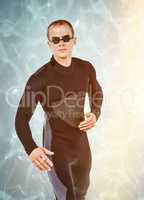 Composite image of swimmer in wetsuit and swimming goggles